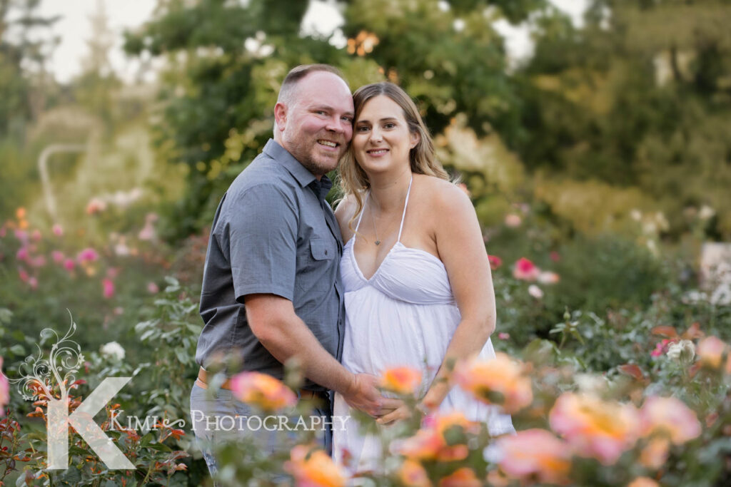 Beautiful and fun maternity session by Kimi Photography in Portland Oregon. Rose garden is a great spot to have your maternity session from May to August.